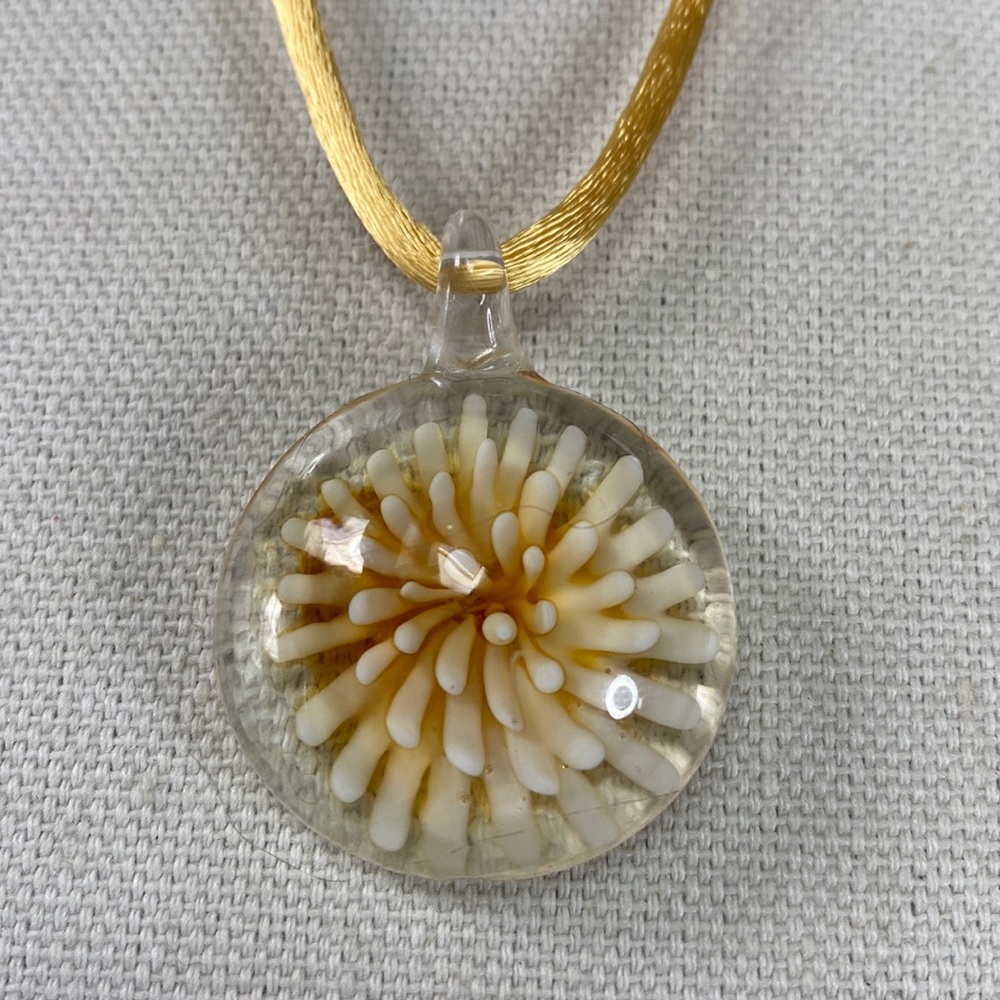 Clear glass flower medallion style necklace